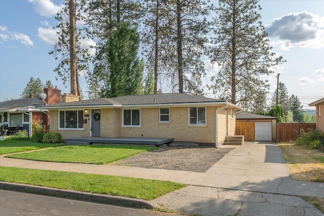 5615 N Forest Blvd, Spokane, WA 99205 - ranch-style home with a detached garage, an outbuilding, brick siding, driveway, and a chimney
