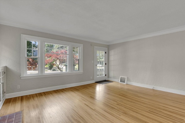 8 W 26th Ave, Spokane, WA 99203 - unfurnished living room with hardwood / wood-style flooring and ornamental molding
