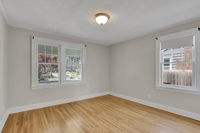 8 W 26th Ave, Spokane, WA 99203 - spare room with light wood-style flooring and crown molding