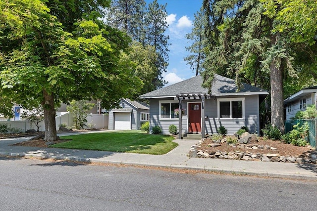 1409 E 36th Ave, Spokane, WA 99203 - view of front of home featuring an outbuilding, driveway, and roof with shingles