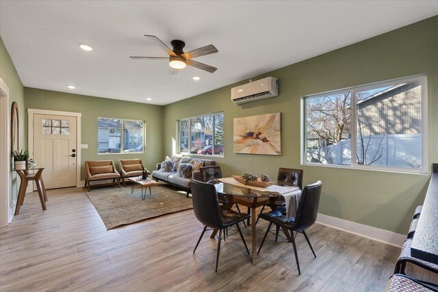 1409 E 36th Ave, Spokane, WA 99203 - dining room featuring a wall unit AC, healthy amount of natural light, light wood-type flooring, a ceiling fan, and recessed lighting