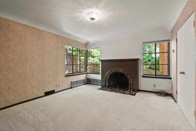 1827 S Arthur St, Spokane, WA 99203 - unfurnished living room with carpet and a fireplace with flush hearth