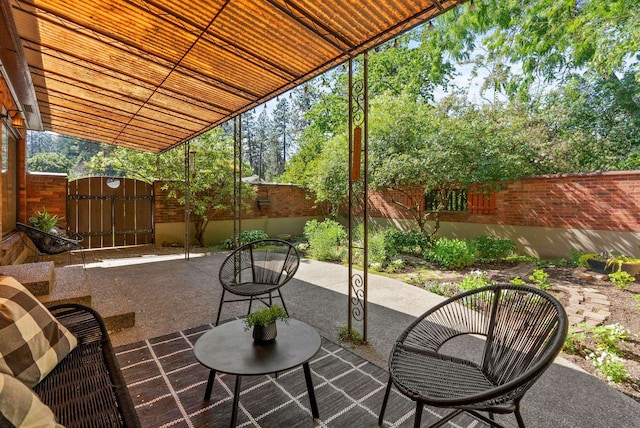 1827 S Arthur St, Spokane, WA 99203 - fenced backyard featuring a gate and a patio area