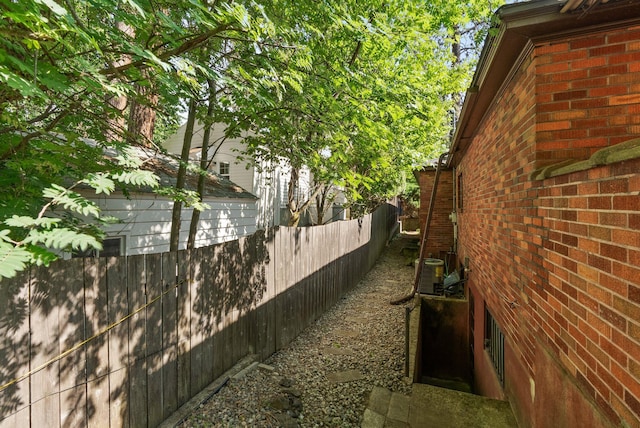 1827 S Arthur St, Spokane, WA 99203 - view of side of property featuring brick siding and a cooling unit