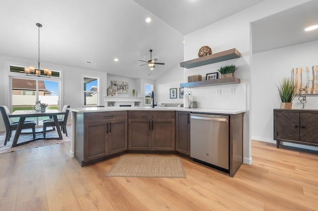 1714 S Moen St Unit 2/1Umpqua, Spokane Valley, WA 99016 - kitchen featuring stainless steel dishwasher, vaulted ceiling, light countertops, open shelves, and light wood-style floors