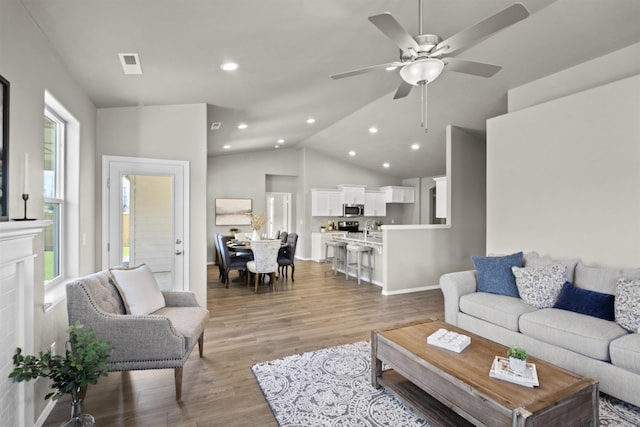 18126 E Barclay Ct Unit 3/4Snowbrush, Spokane Valley, WA 99016 - living room featuring light wood-type flooring, recessed lighting, lofted ceiling, and ceiling fan