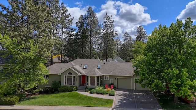 4307 S Apollo St, Spokane, WA 99223 - ranch-style home featuring an attached garage, driveway, a front lawn, stucco siding, and a shingled roof