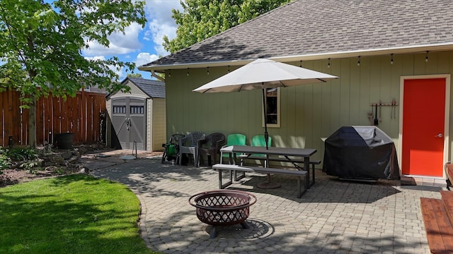 4307 S Apollo St, Spokane, WA 99223 - view of patio / terrace with a storage shed, area for grilling, and an outdoor fire pit