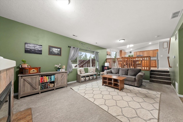 4031 S Bates Rd, Spokane Valley, WA 99206 - living room featuring carpet flooring, lofted ceiling, stairway, and a textured ceiling
