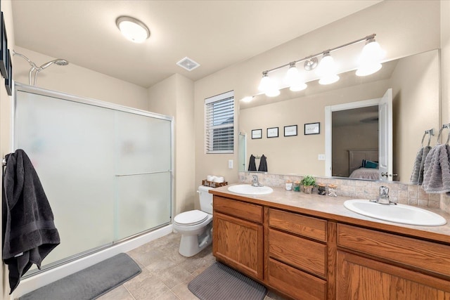 4031 S Bates Rd, Spokane Valley, WA 99206 - ensuite bathroom featuring a stall shower, double vanity, and tile patterned floors