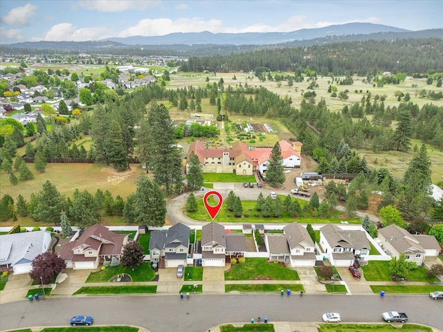 4031 S Bates Rd, Spokane Valley, WA 99206 - aerial view of property and surrounding area with mountains and nearby suburban area