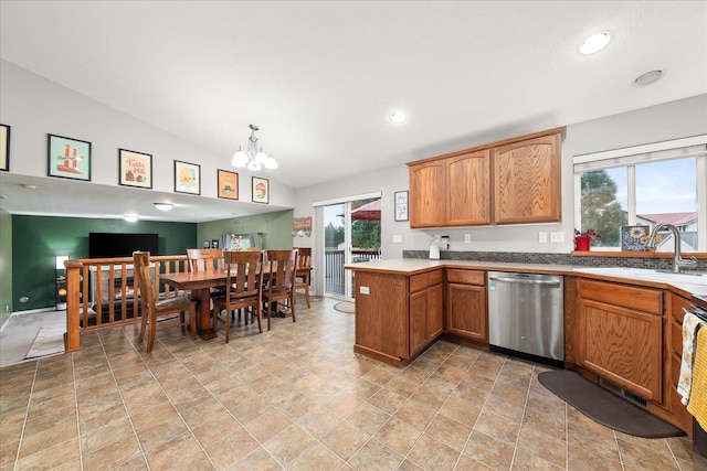 4031 S Bates Rd, Spokane Valley, WA 99206 - kitchen featuring dishwasher, a peninsula, a chandelier, stone finish floors, and lofted ceiling