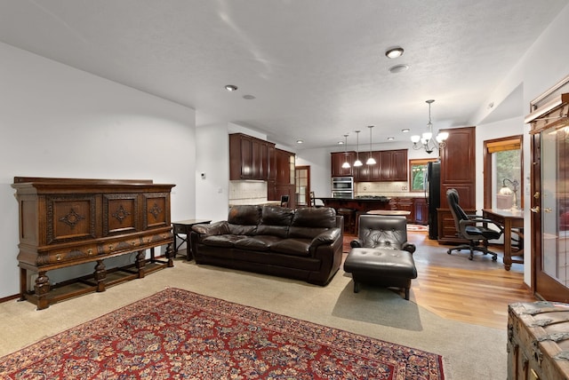 12910 S Fairway Ridge Ln, Spokane, WA 99224 - living room featuring light colored carpet, a chandelier, recessed lighting, and a desk