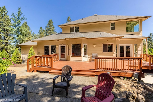 12910 S Fairway Ridge Ln, Spokane, WA 99224 - back of property featuring french doors, a wooden deck, and a shingled roof