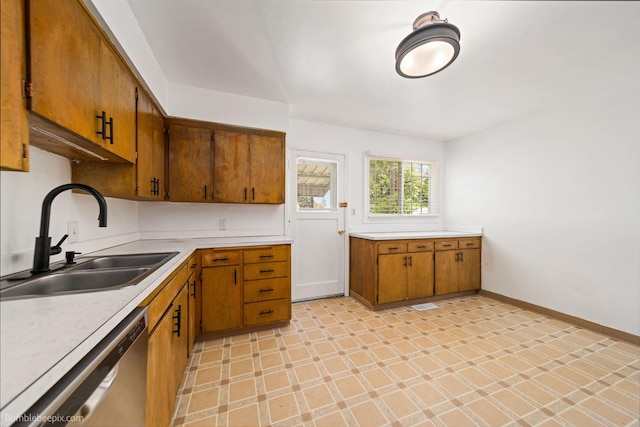 1306 W Joseph Ave, Spokane, WA 99205 - kitchen featuring dishwasher, light countertops, brown cabinetry, and light floors