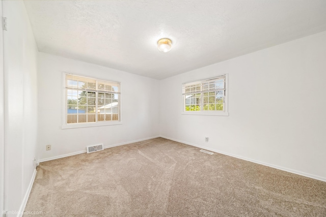 1306 W Joseph Ave, Spokane, WA 99205 - carpeted spare room featuring a textured ceiling