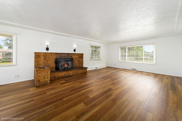 1306 W Joseph Ave, Spokane, WA 99205 - unfurnished living room with plenty of natural light, dark wood-style flooring, and a textured ceiling