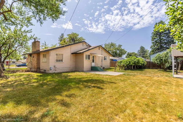 1306 W Joseph Ave, Spokane, WA 99205 - back of property featuring a chimney and a patio