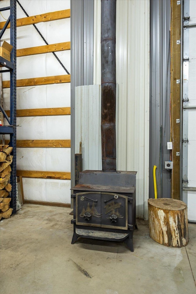5919 E Grouse Rd, Chattaroy, WA 99003 - detailed view of a wood stove and unfinished concrete flooring
