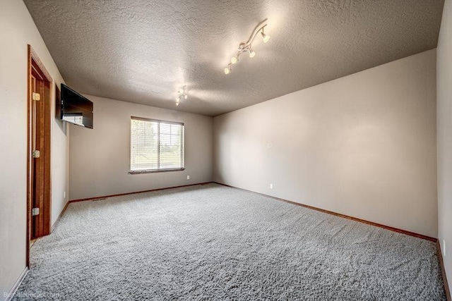 20051 E Meyers Ave, Liberty Lake, WA 99019 - spare room with light colored carpet and a textured ceiling