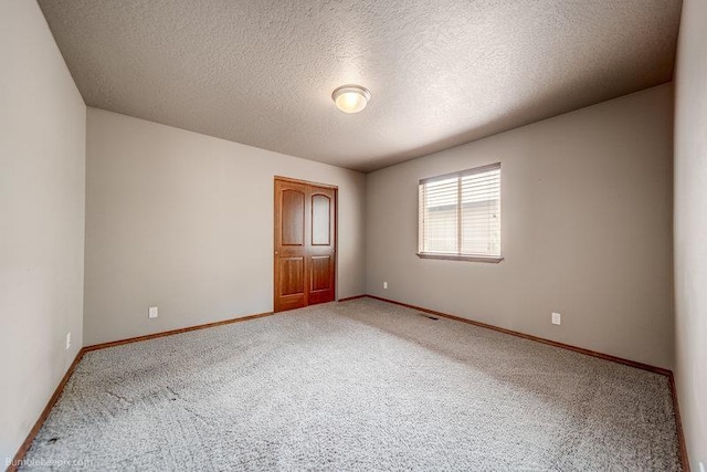 20051 E Meyers Ave, Liberty Lake, WA 99019 - empty room featuring light colored carpet and a textured ceiling