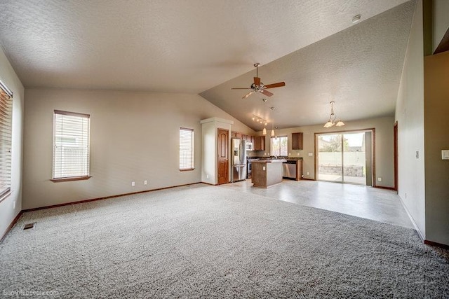 20051 E Meyers Ave, Liberty Lake, WA 99019 - unfurnished living room with a ceiling fan, lofted ceiling, light carpet, a chandelier, and a textured ceiling
