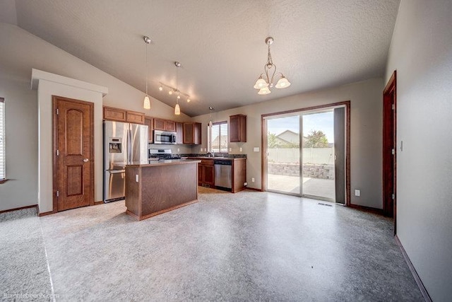 20051 E Meyers Ave, Liberty Lake, WA 99019 - kitchen with appliances with stainless steel finishes, lofted ceiling, a chandelier, hanging light fixtures, and a center island