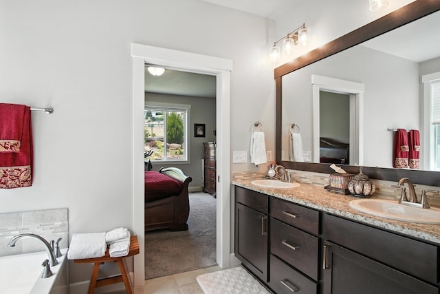 2630 S Fairmont Estates Ct, Greenacres, WA 99016 - bathroom featuring connected bathroom, double vanity, a tub, and tile patterned flooring