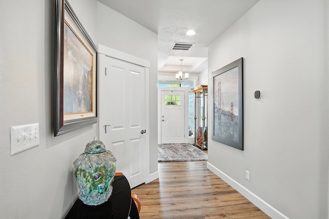2630 S Fairmont Estates Ct, Greenacres, WA 99016 - corridor featuring a chandelier and light wood finished floors