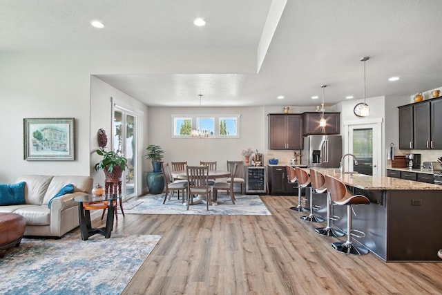 2630 S Fairmont Estates Ct, Greenacres, WA 99016 - living room featuring light wood finished floors, recessed lighting, and wine cooler