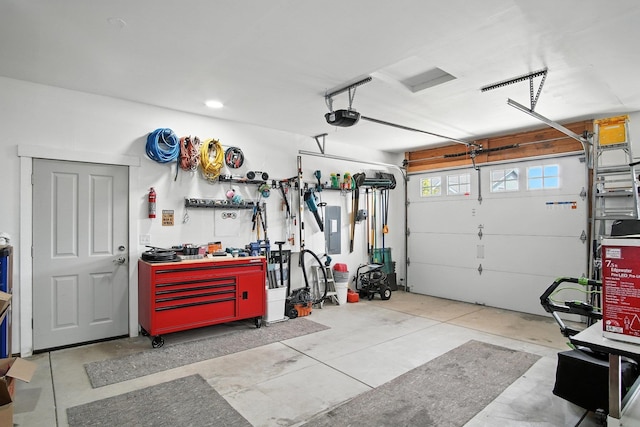 2630 S Fairmont Estates Ct, Greenacres, WA 99016 - garage featuring a garage door opener and electric panel