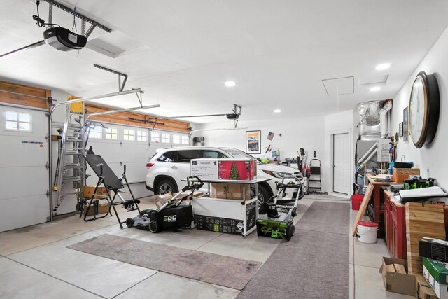 2630 S Fairmont Estates Ct, Greenacres, WA 99016 - garage featuring a garage door opener and recessed lighting