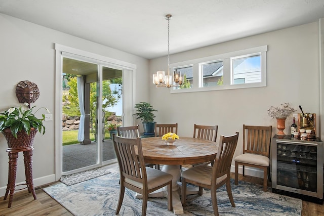 2630 S Fairmont Estates Ct, Greenacres, WA 99016 - dining room featuring wine cooler, healthy amount of natural light, wood finished floors, and a chandelier