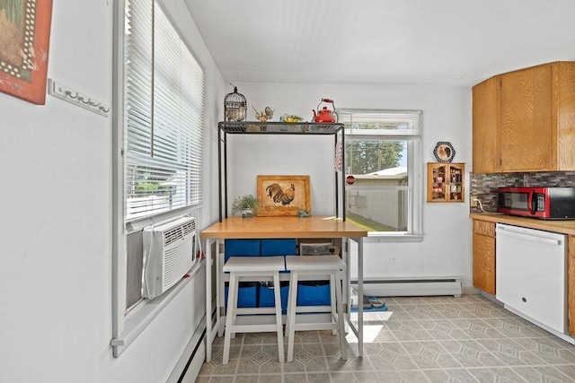 5204 N Belt St, Spokane, WA 99205 - kitchen featuring white dishwasher, stainless steel microwave, a baseboard heating unit, decorative backsplash, and brown cabinets