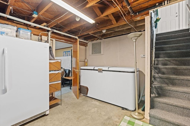 5204 N Belt St, Spokane, WA 99205 - unfinished below grade area with refrigerator, freestanding refrigerator, and stairway