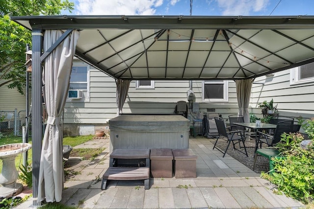 5204 N Belt St, Spokane, WA 99205 - view of patio featuring a gazebo, a hot tub, cooling unit, and outdoor dining space