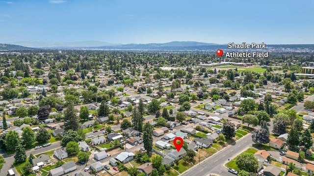 5204 N Belt St, Spokane, WA 99205 - aerial view of property and surrounding area featuring a mountain backdrop and nearby suburban area