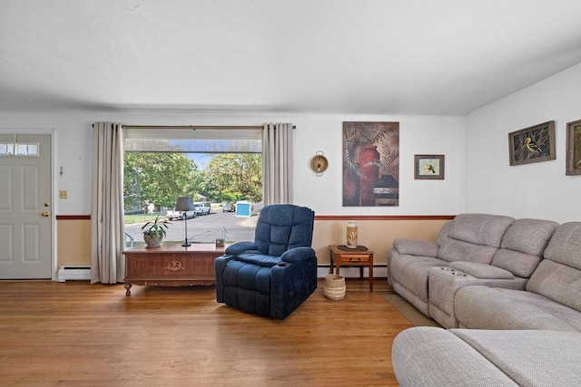5204 N Belt St, Spokane, WA 99205 - living room with a baseboard heating unit, wood finished floors, and baseboard heating