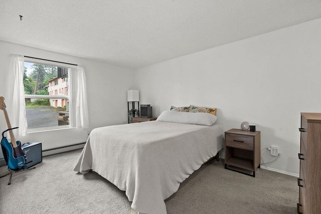 844 W Cliff Dr Unit 206, Spokane, WA 99204 - carpeted bedroom with a baseboard heating unit and baseboards