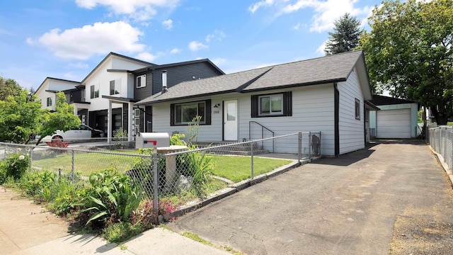3908 E 26th Ave, Spokane, WA 99223 - view of front of home featuring a fenced front yard, roof with shingles, asphalt driveway, and an outdoor structure