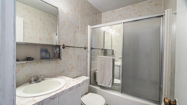 3908 E 26th Ave, Spokane, WA 99223 - full bath with wallpapered walls, vanity, and bath / shower combo with glass door