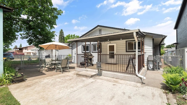 3908 E 26th Ave, Spokane, WA 99223 - view of front facade featuring a fenced backyard, a patio, a gate, and outdoor dining space