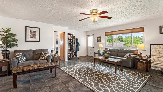 3908 E 26th Ave, Spokane, WA 99223 - living area with ceiling fan and a textured ceiling