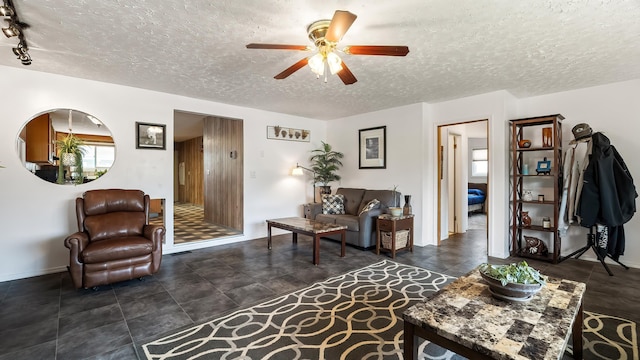 3908 E 26th Ave, Spokane, WA 99223 - living area with ceiling fan and a textured ceiling