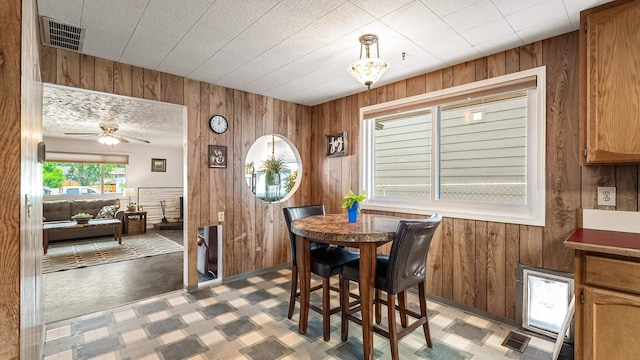 3908 E 26th Ave, Spokane, WA 99223 - dining room with wooden walls and a ceiling fan