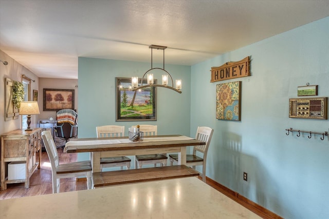 12720 E Kiowa Ct, Spokane Valley, WA 99206 - dining area with a chandelier and wood finished floors