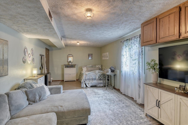 12720 E Kiowa Ct, Spokane Valley, WA 99206 - bedroom with a textured ceiling and baseboards