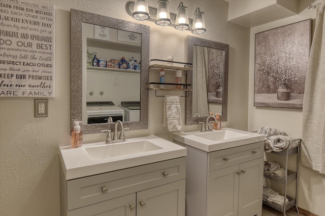 12720 E Kiowa Ct, Spokane Valley, WA 99206 - bathroom with separate washer and dryer, a textured wall, two vanities, and a chandelier