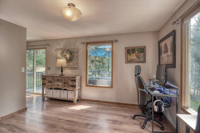 12720 E Kiowa Ct, Spokane Valley, WA 99206 - office with healthy amount of natural light and wood finished floors