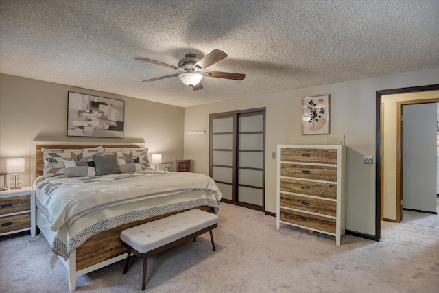 12720 E Kiowa Ct, Spokane Valley, WA 99206 - bedroom featuring light colored carpet, a closet, ceiling fan, and a textured ceiling